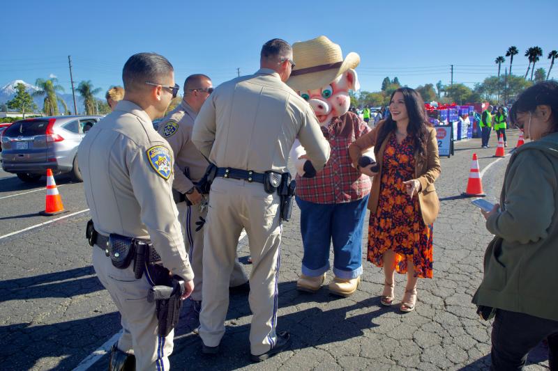 Senator Susan Rubio seen with Thumper from Pomona Fairplex and Local CHP Distributing Groceries and Turkey