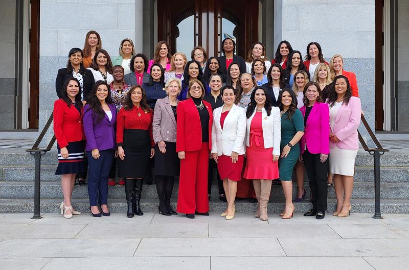 Group of women legislators standing on the marble steps of the California CapitolGroup of women legislators standing on the marble steps of the California Capitol