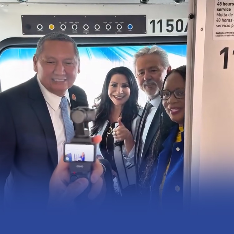 Senator Rubio and local officials pose for a photo in the driver's cab of the Metro A Line train