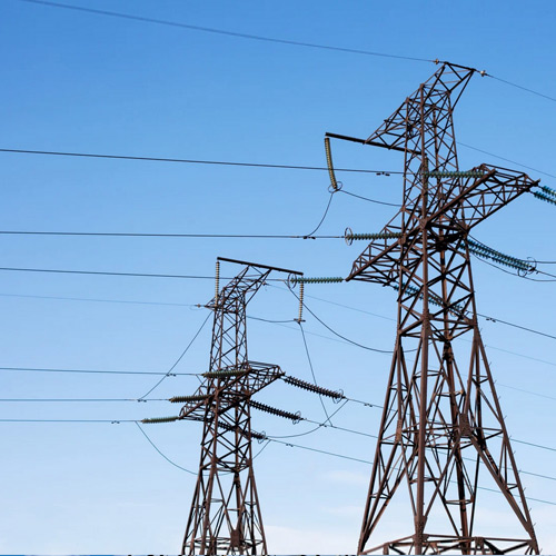 High energy transmission lines over a blue sky